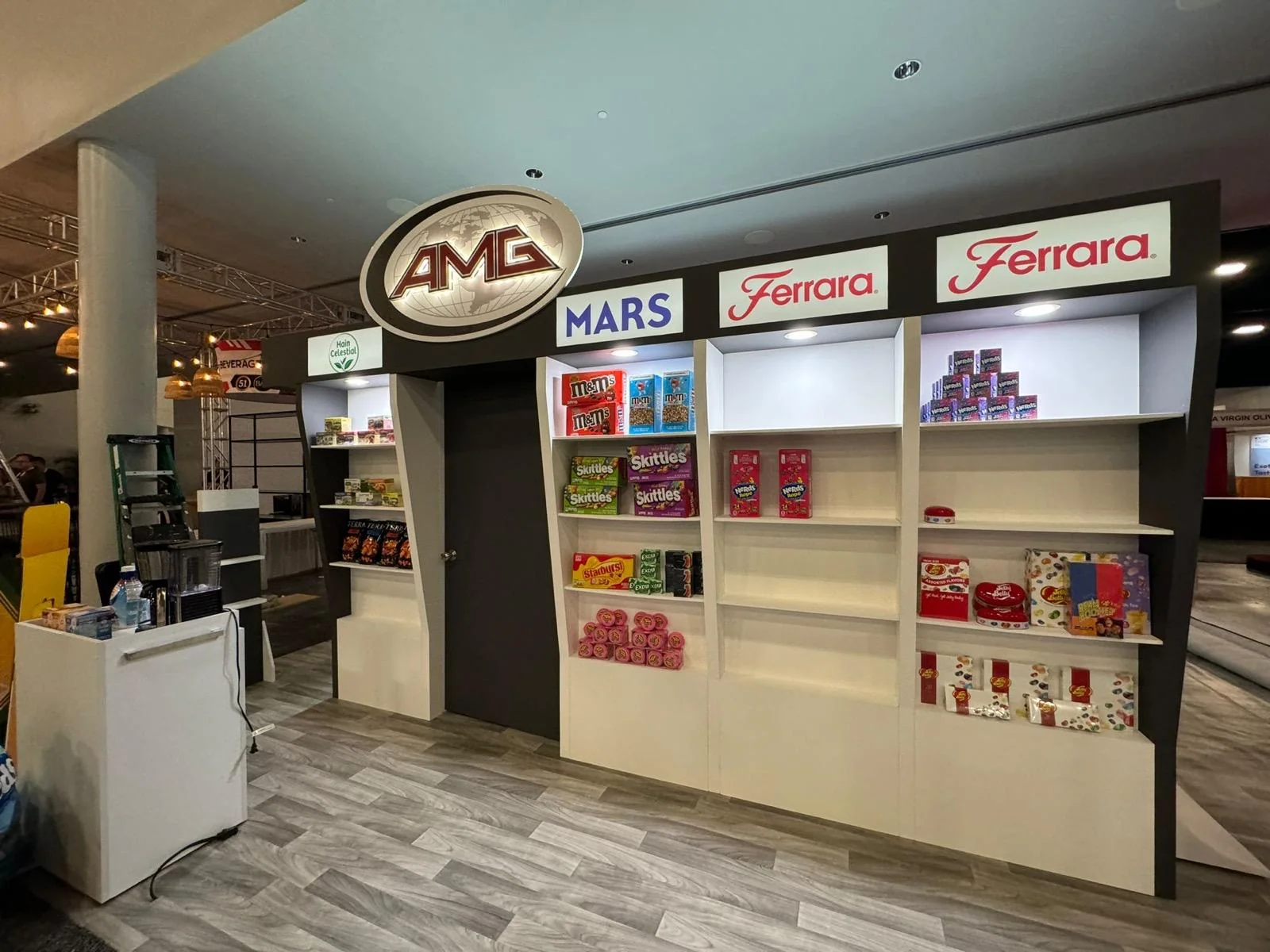 Professional trade show booth display for AMG Global Distribution featuring custom branding, modern design elements, and interactive exhibition space in Miami, Florida.
