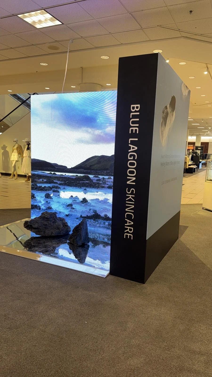 Custom brand activation backdrop designed and fabricated by Habitar 91 for Blue Lagoon Skincare featuring branded graphics and professional finish