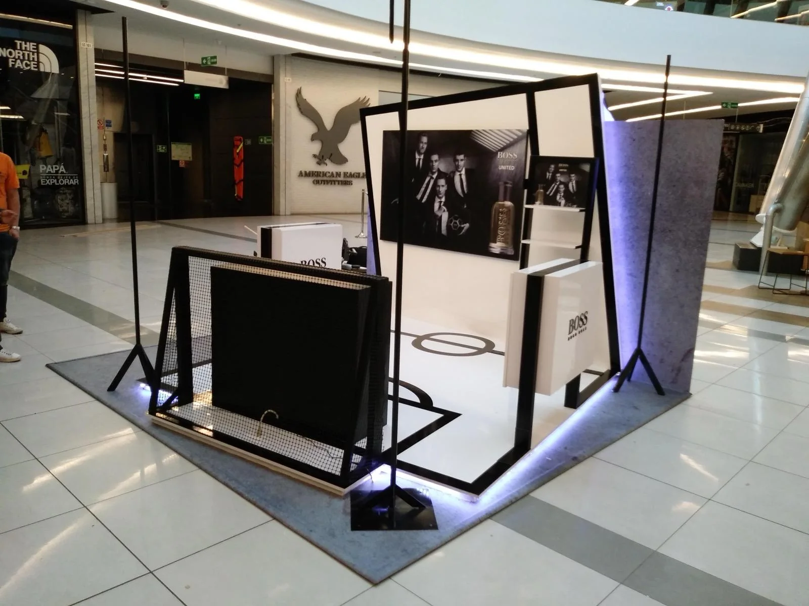 Custom branded retail display for Boss store featuring modern commercial interior design and fabrication by Habitar 91