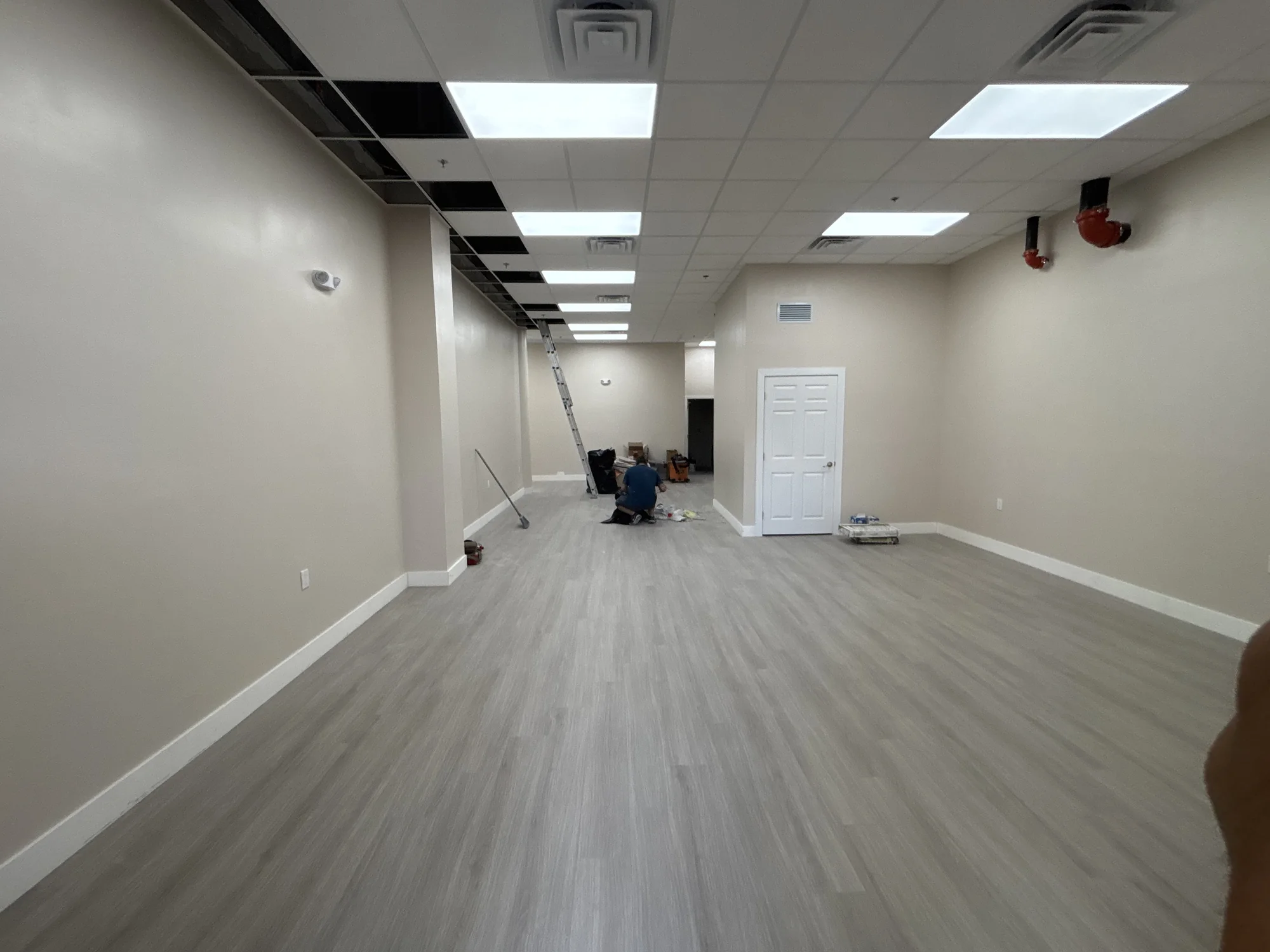 Commercial interior construction in progress at Bella Vida Adult Care Center in Davie, Florida, showing build-out phase by Habitar 91