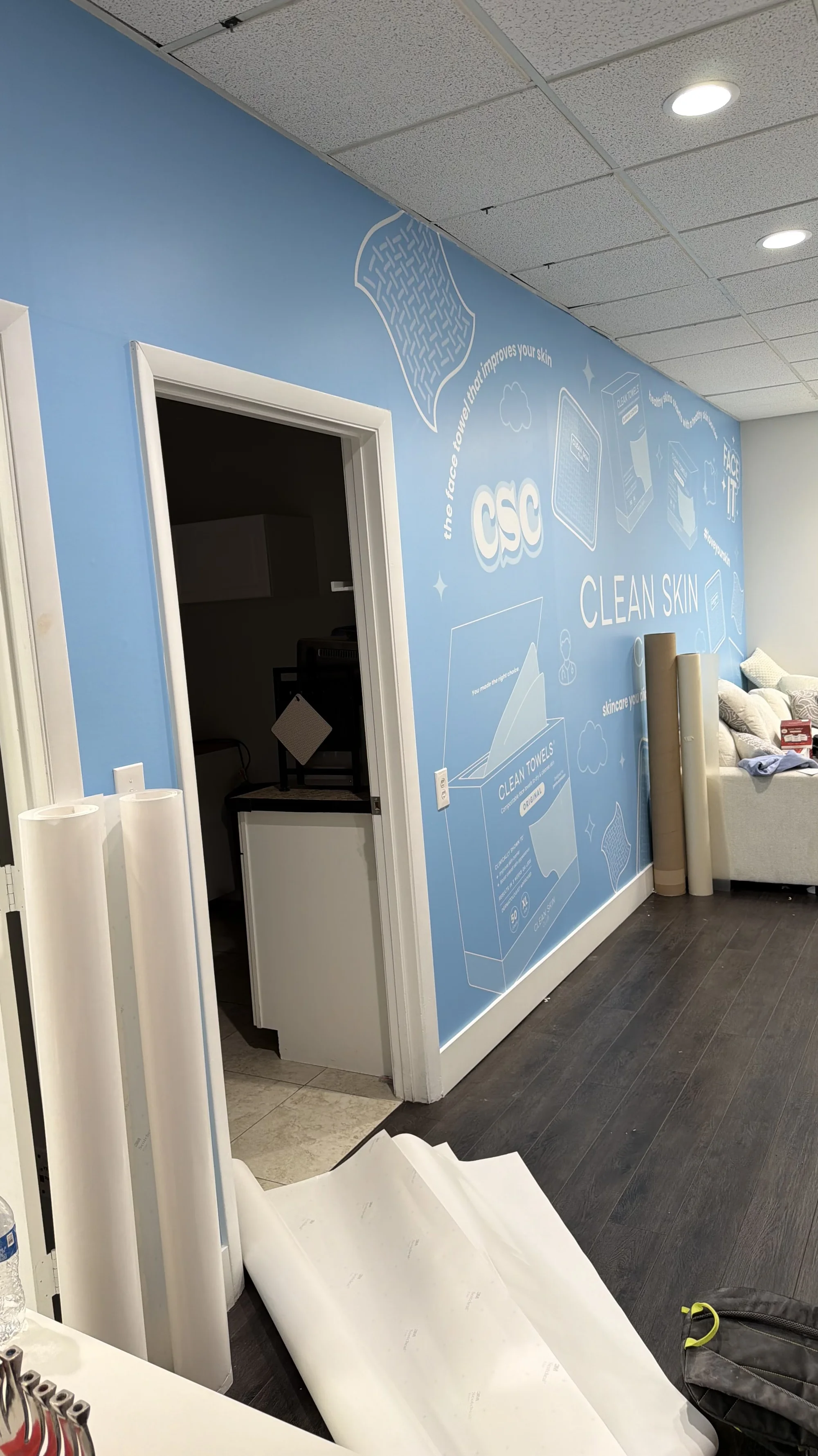 Professional wall graphics installation for Clean Skin Club featuring modern design elements and branding in Weston, Florida