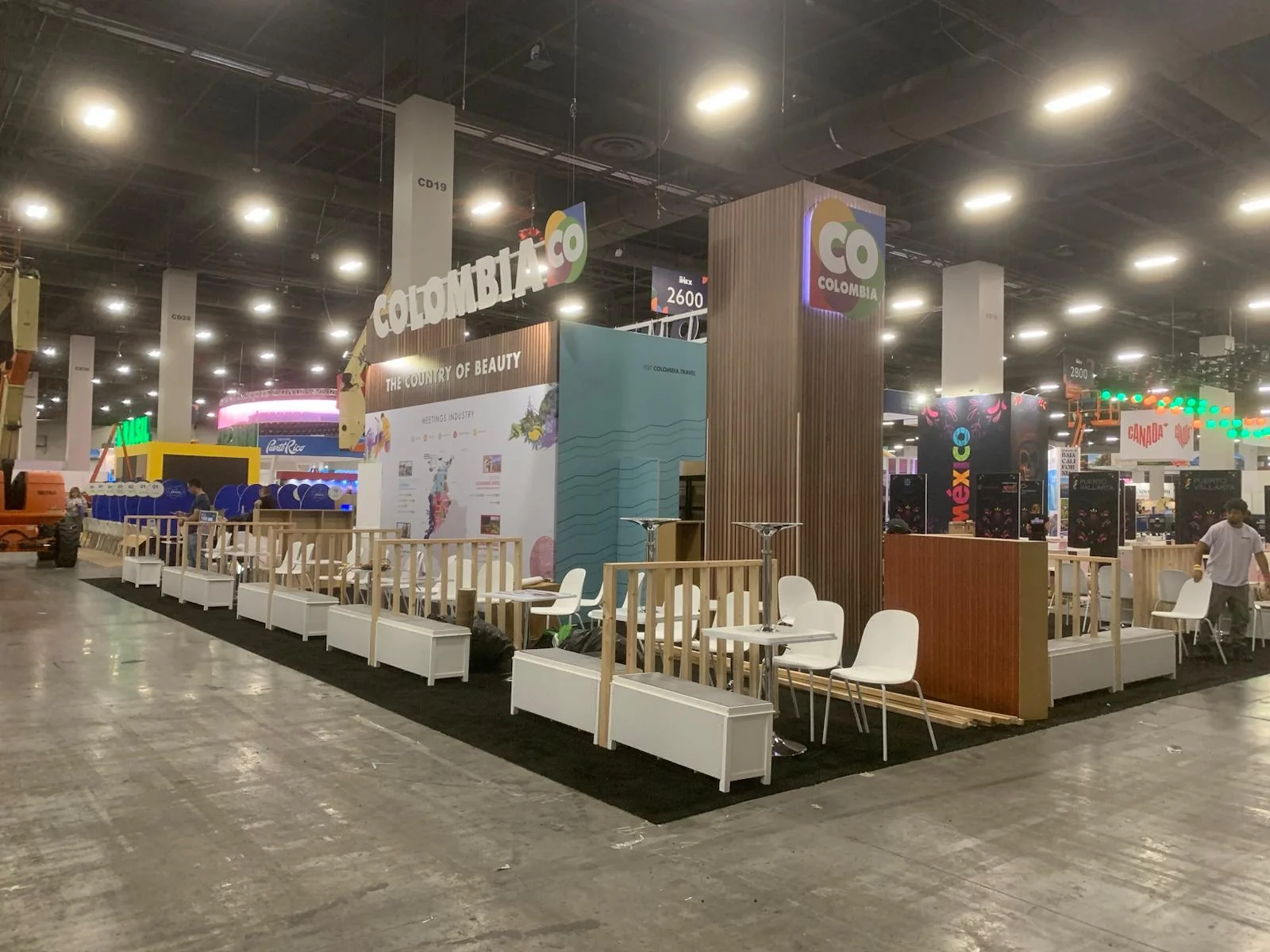 Professional trade show booth for Co Colombia featuring custom branding, modern design elements, and interactive display setup at Houston trade show event