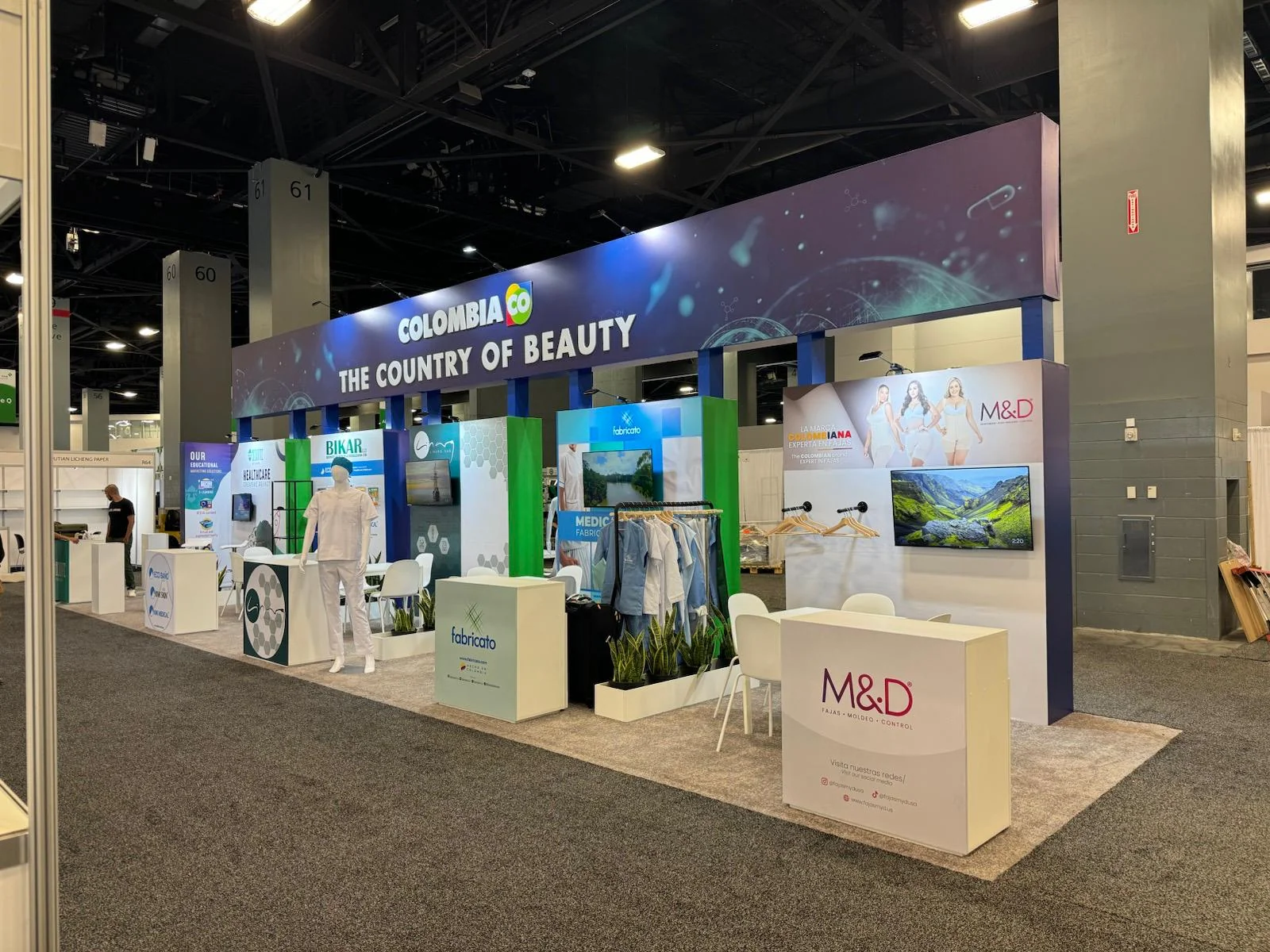 Professional trade show booth for Co Colombia featuring custom branding, modern design elements, and interactive display areas at Las Vegas event venue
