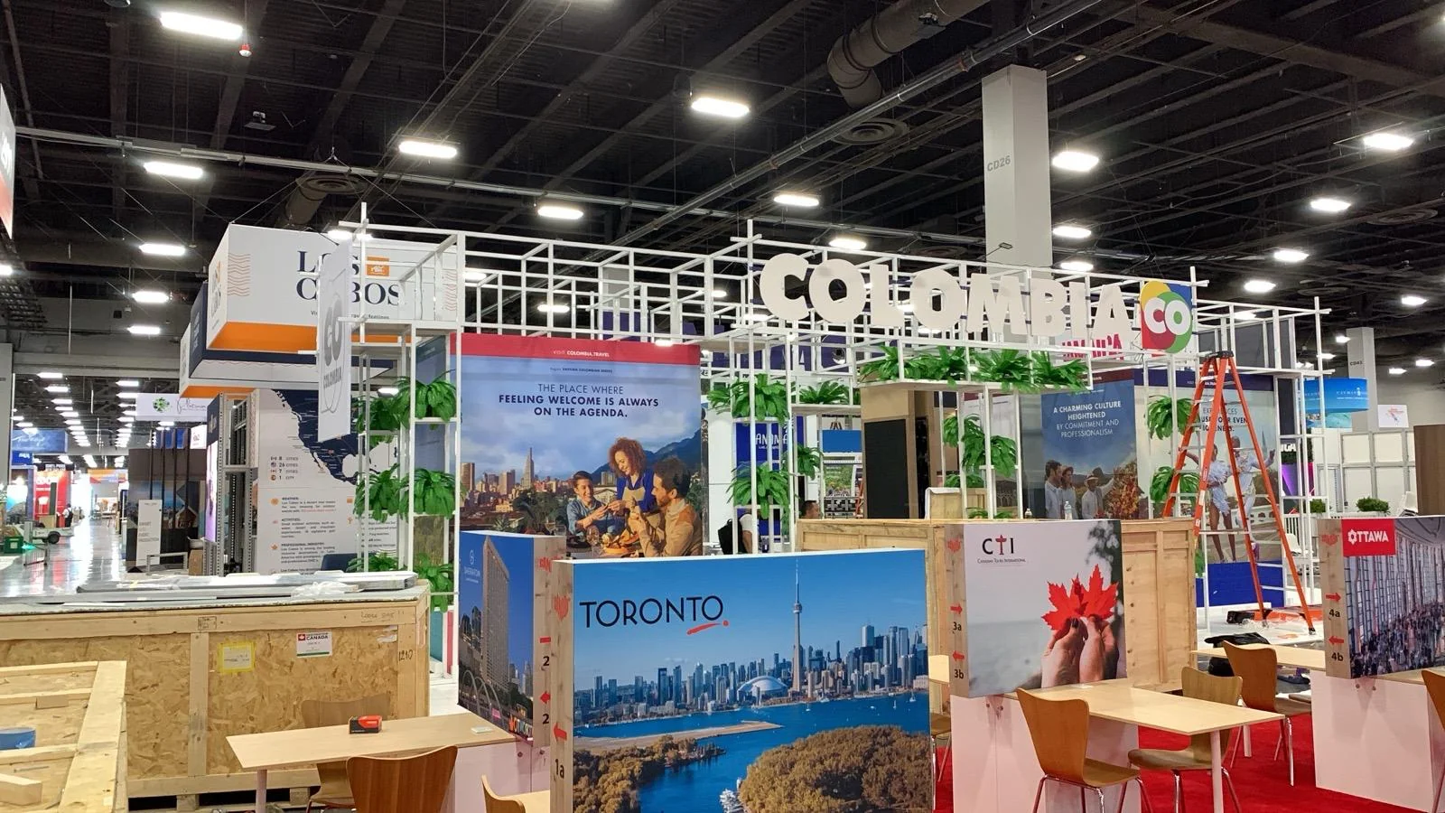 Modern trade show booth for Co Colombia featuring custom branding, professional display design, and branded environments at San Diego event