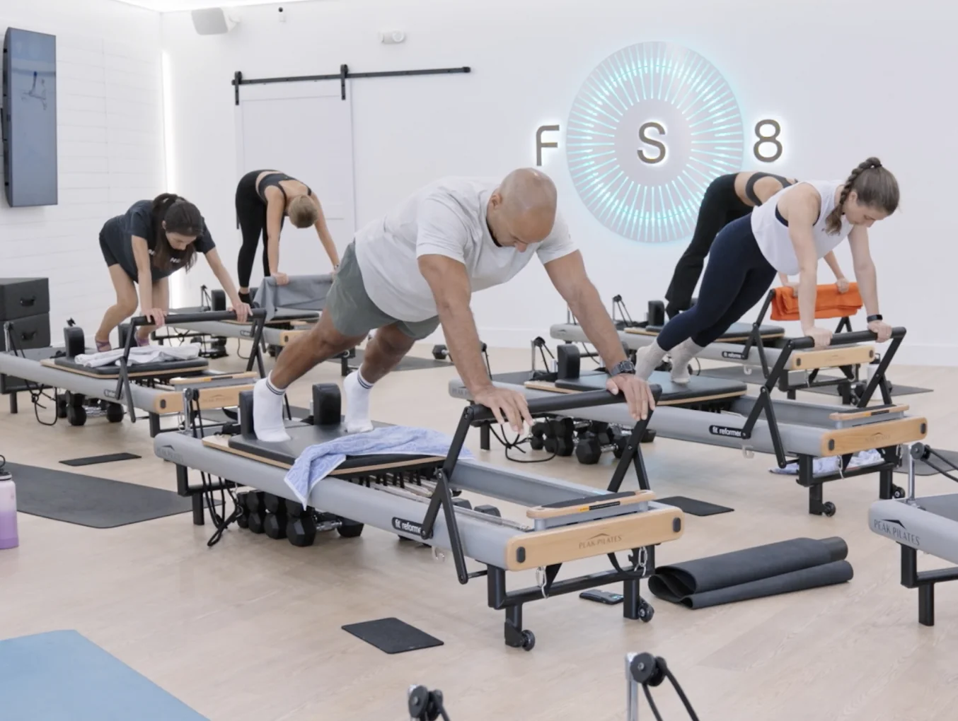 Interior construction and buildout of FS8 Pilates fitness studio in Davie, Florida, showcasing commercial design and installation work by Habitar 91