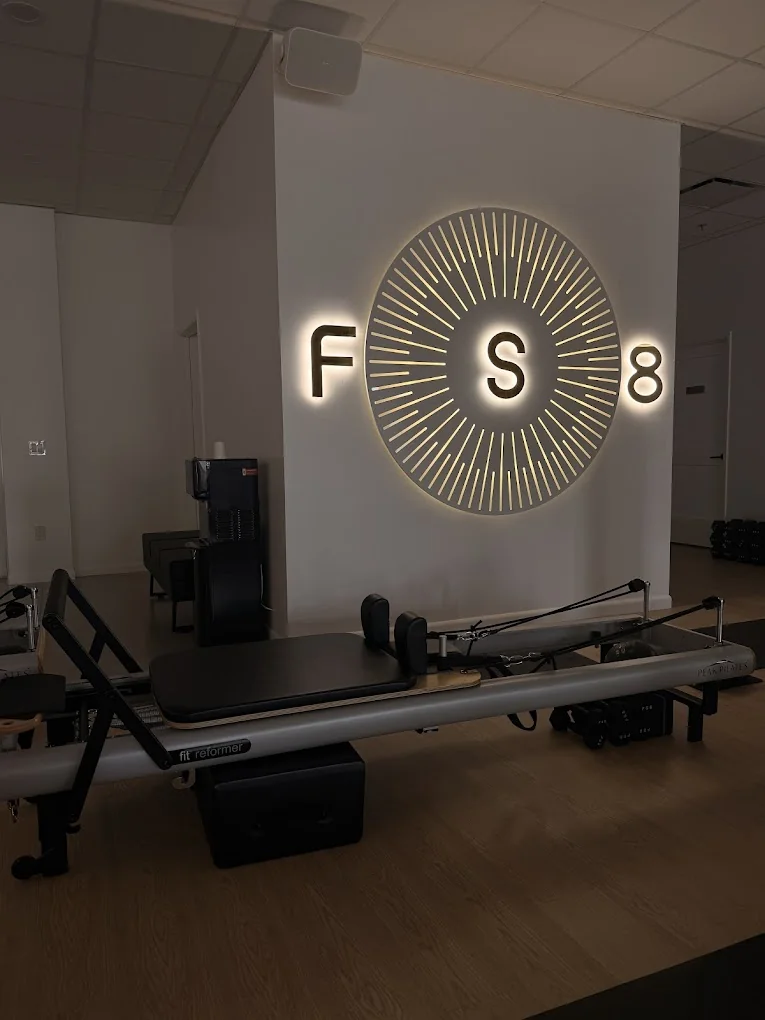 Interior construction and buildout of FS8 Pilates fitness studio in Davie, Florida, showcasing commercial design and installation by Habitar 91