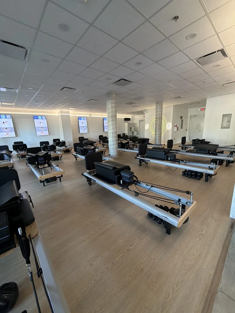 Interior construction progress of FS8 Pilates fitness studio in Davie, Florida, showing buildout and installation work by Habitar 91
