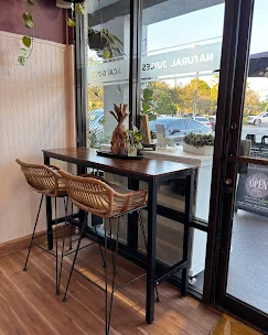 Modern juice bar interior at Maraneros in Davie, Florida, featuring custom design elements, branded finishes, and contemporary commercial buildout by Habitar 91