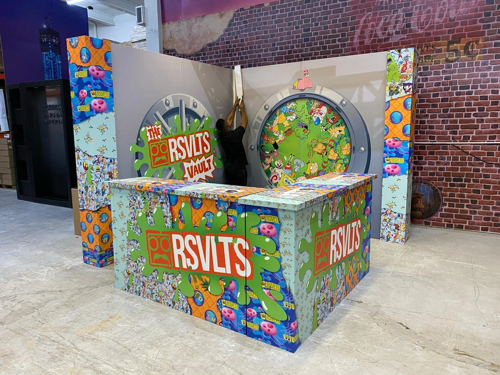 Custom cardboard trade show booth for RSVLTS featuring branded design and structural elements, created by Habitar 91