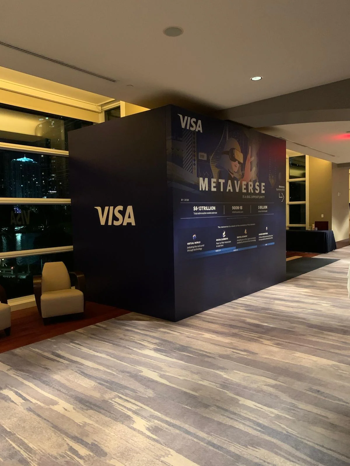 Professional brand activation display for Visa featuring custom designed environment with branded graphics and interactive elements at Miami event
